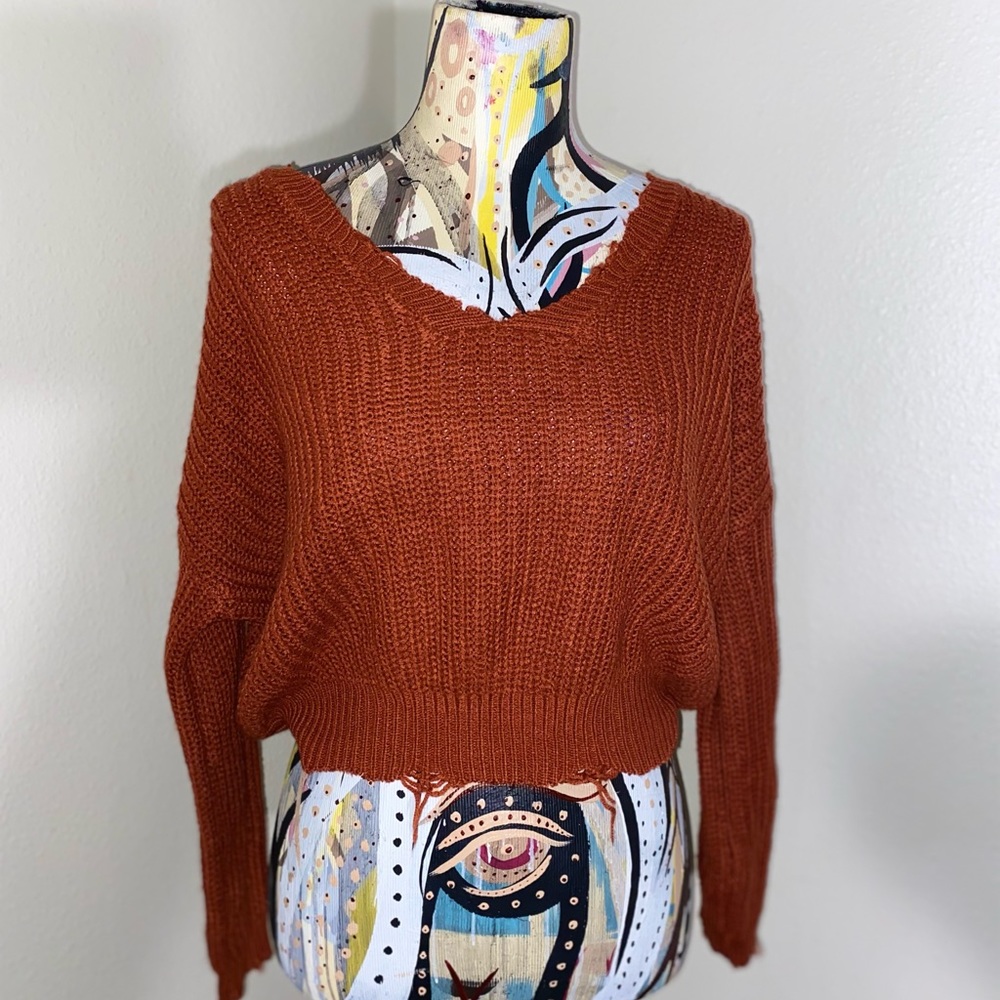 Burnt orange distressed sweater. Size: XS.